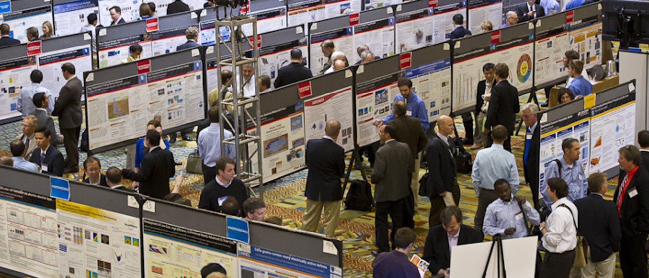 Photo: Poster session, SunShot Grand Challenge Summit and Technology Forum, Denver; Dennis Schroeder/NREL via flickr.com. Public domain (US government agency).